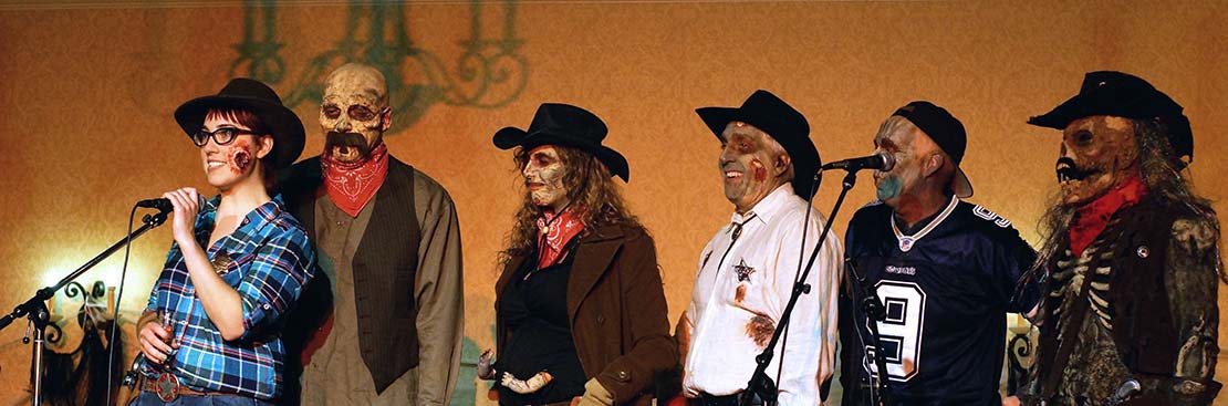 attendees in Halloween costumes